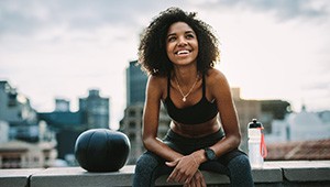 smiling active person sitting down